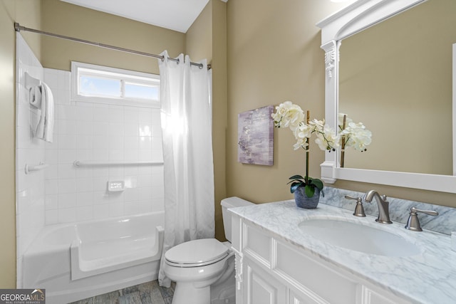 full bathroom with vanity, toilet, and shower / tub combo