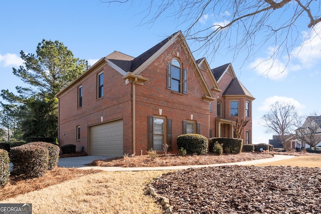 view of side of home featuring a garage