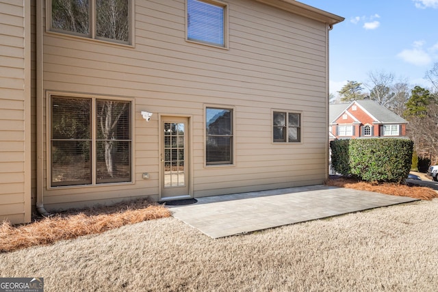 back of property featuring a patio area