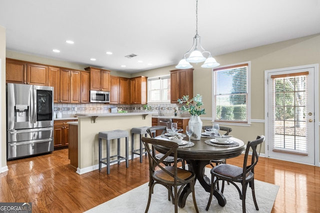 dining room with hardwood / wood-style floors