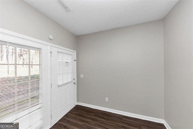 foyer entrance with dark wood-type flooring