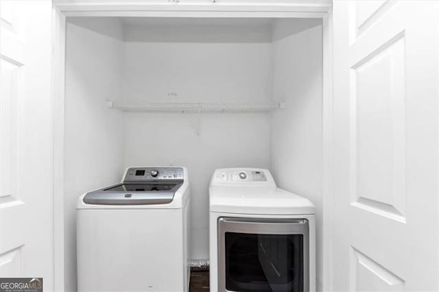 laundry area featuring washing machine and dryer