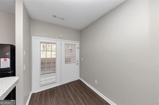 doorway to outside with dark hardwood / wood-style floors