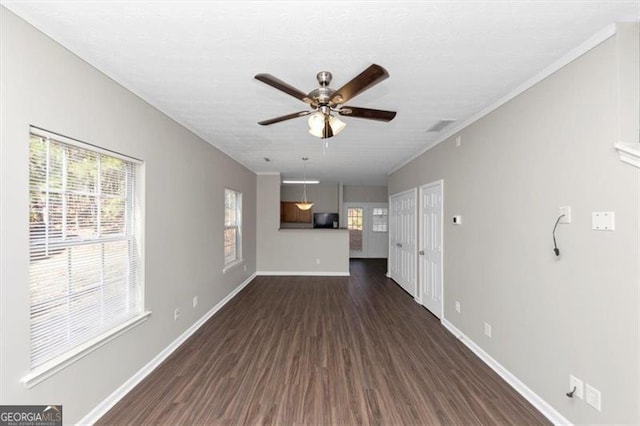 unfurnished living room with ceiling fan and dark hardwood / wood-style flooring