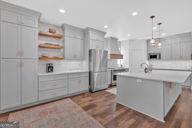 kitchen featuring gray cabinetry, custom exhaust hood, and stainless steel appliances