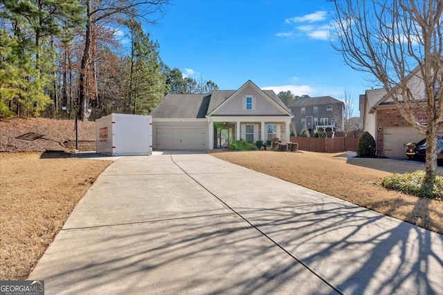 view of front of property with a garage and a front yard