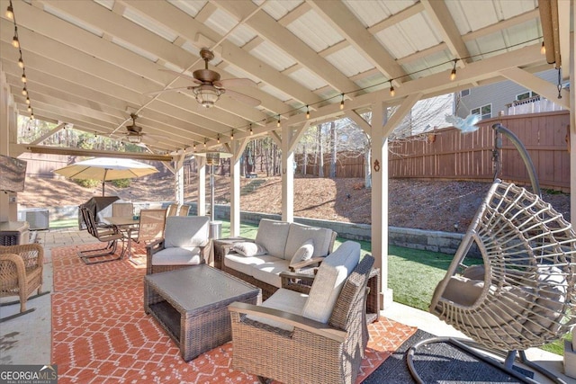 view of patio / terrace with an outdoor hangout area, central AC unit, and ceiling fan