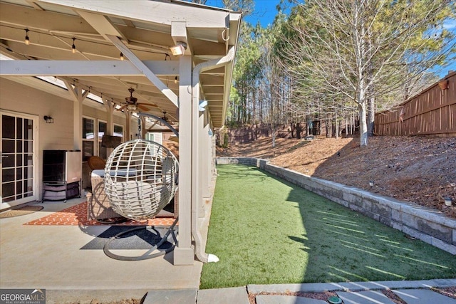 view of yard featuring a patio and ceiling fan