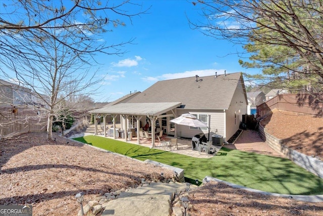 rear view of property with cooling unit and a patio area