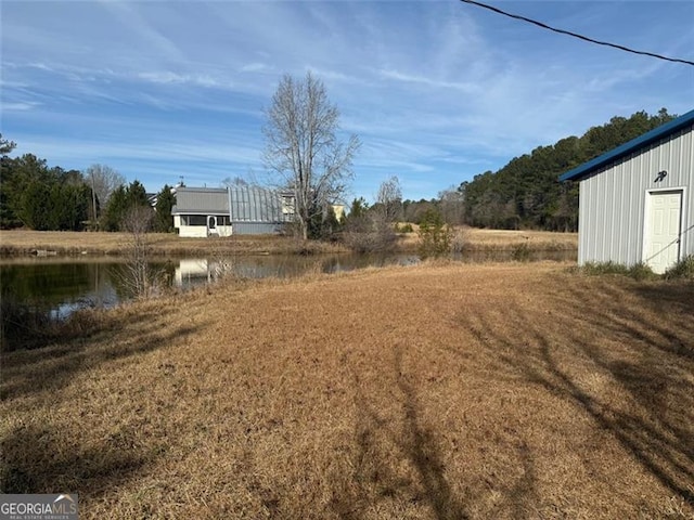 view of yard with a water view