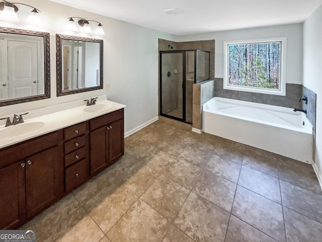 bathroom with plus walk in shower, vanity, and tile patterned floors