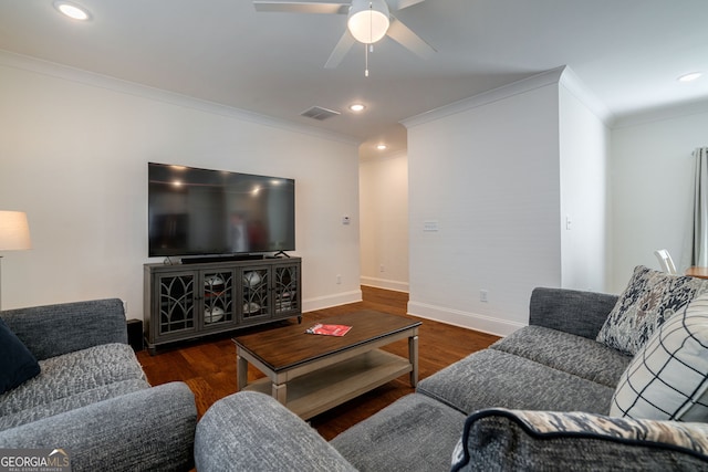 living room with crown molding, ceiling fan, and dark hardwood / wood-style floors