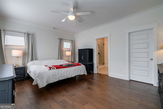 bedroom with dark wood-type flooring and multiple windows