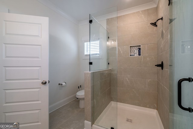 bathroom with walk in shower, ornamental molding, and toilet