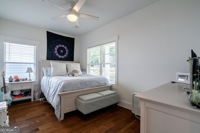 bedroom with dark wood-type flooring and ceiling fan