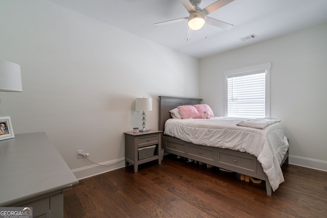 bedroom featuring ceiling fan and dark hardwood / wood-style floors