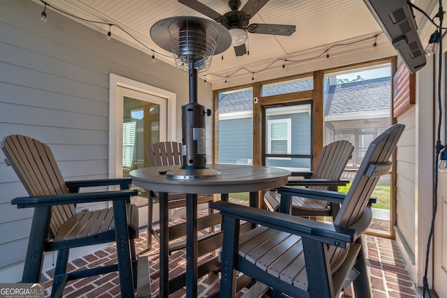 sunroom / solarium with ceiling fan