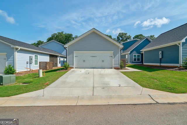 ranch-style home with a garage and a front yard