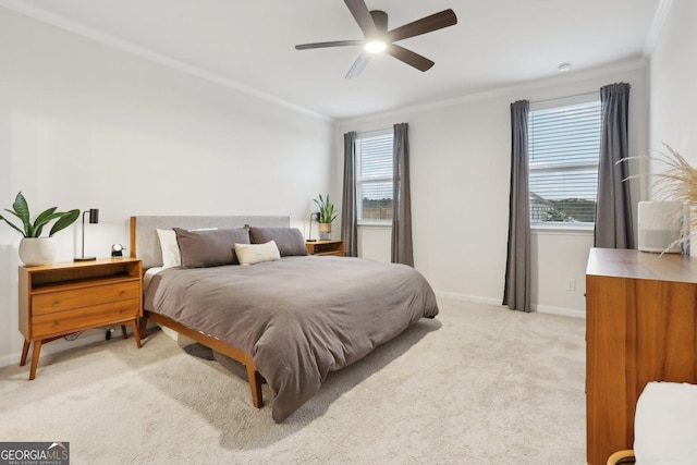 bedroom featuring light carpet, crown molding, and ceiling fan