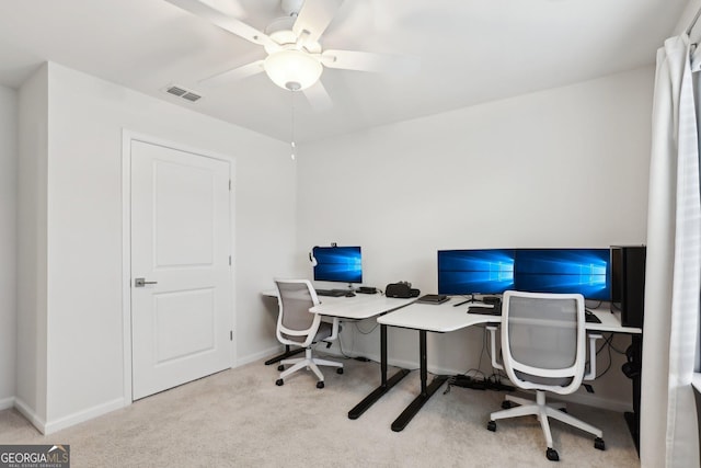 office area featuring light colored carpet and ceiling fan