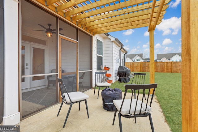 view of patio with grilling area and a pergola