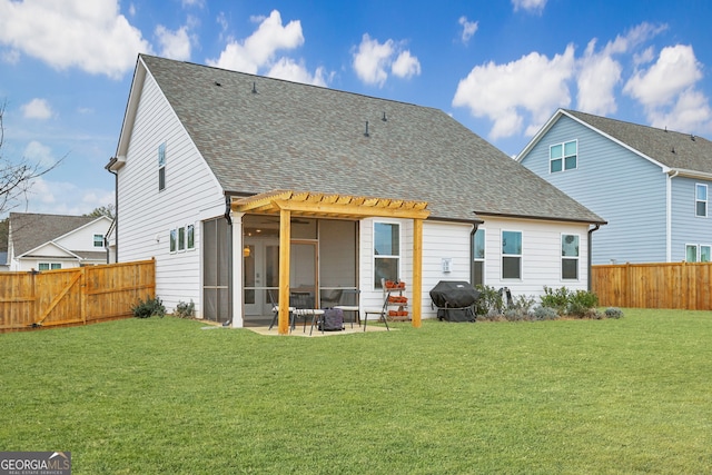 back of house with a sunroom, a lawn, a patio area, and a pergola