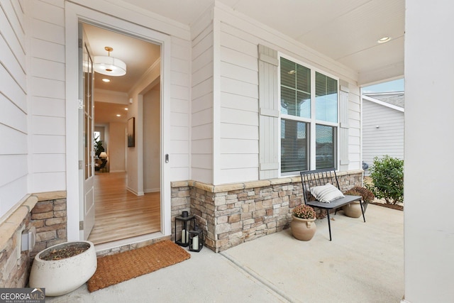 property entrance featuring covered porch