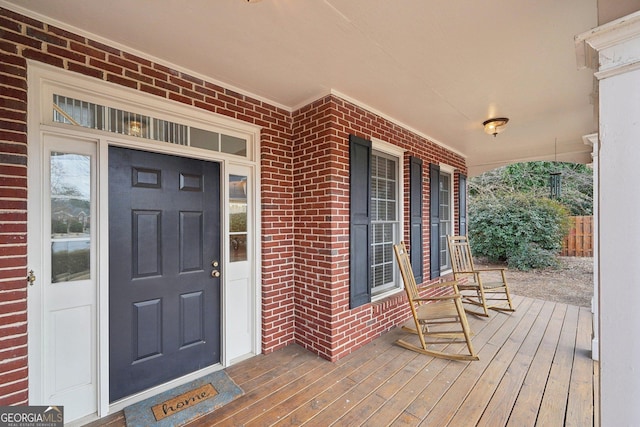 doorway to property with covered porch