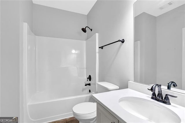 full bath with visible vents, vanity, shower / tub combination, and toilet