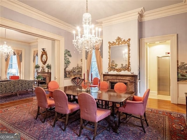 dining space featuring hardwood / wood-style flooring, a wealth of natural light, and a notable chandelier