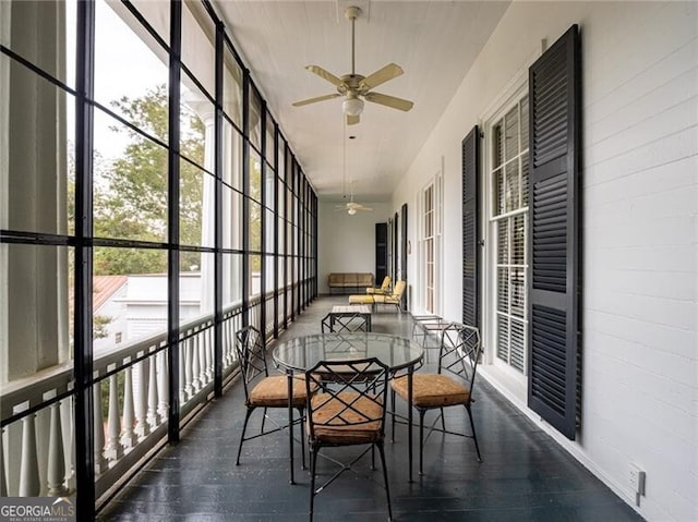 sunroom / solarium with ceiling fan