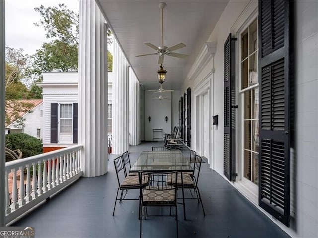 balcony with ceiling fan and a porch