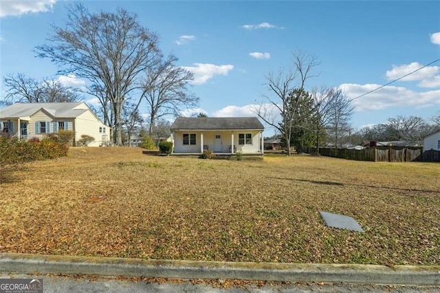 view of front of house with a porch and a front lawn