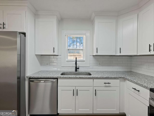 kitchen featuring white cabinetry, appliances with stainless steel finishes, and sink