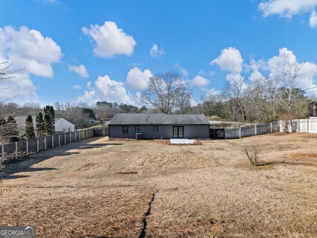 back of house featuring central AC