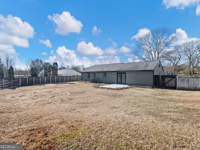 rear view of property with a patio area and a lawn