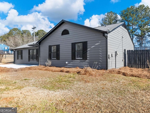 exterior space with a front yard and a patio