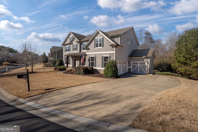 view of front of home featuring a porch, a garage, and a front yard