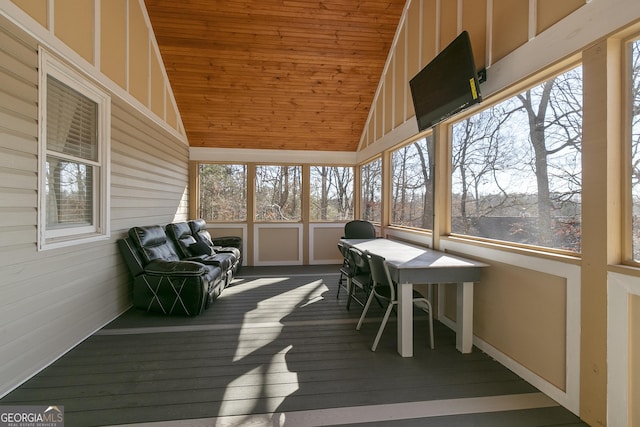 sunroom / solarium featuring vaulted ceiling and wooden ceiling