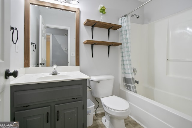 full bathroom featuring vanity, shower / tub combo, and toilet