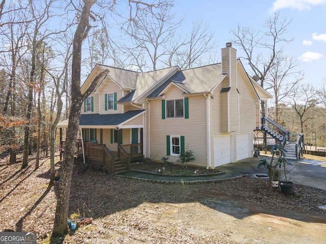 view of front of property with a garage and a porch