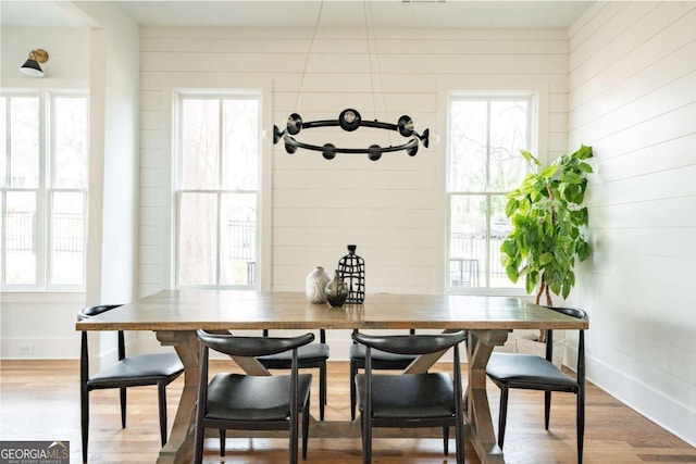 dining area with hardwood / wood-style floors