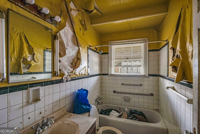 full bathroom with  shower combination, toilet, tile walls, and vanity