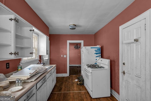 kitchen with white cabinetry, white gas range, dark wood-type flooring, and sink