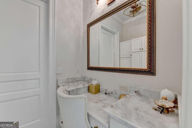 bathroom featuring vanity and ornamental molding