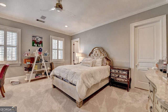 bedroom with ornamental molding, light colored carpet, and ceiling fan