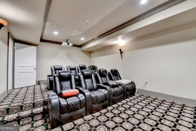 carpeted cinema featuring ornamental molding