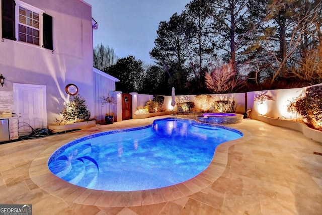 view of pool featuring an in ground hot tub and a patio