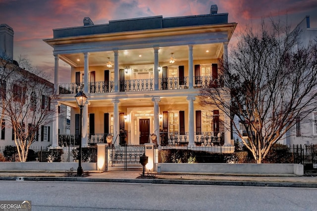 view of front of property with a balcony