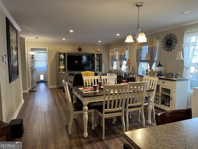 dining space with crown molding and dark wood-type flooring